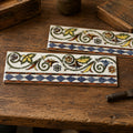 Retro Tile by Standard Tile vintage majolica ceramic border tile with acanthus leaf scroll and checkerboard pattern.